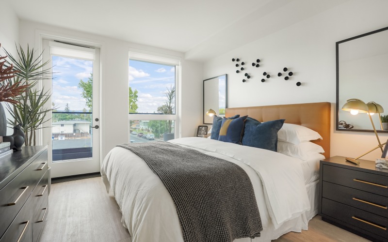 bedroom with hats hanging on the wall