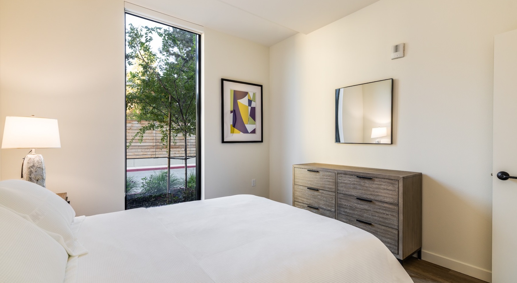 Bedroom with natural lighting and high ceilings