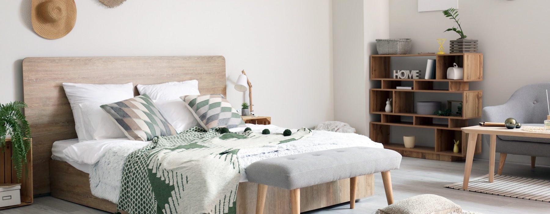 bedroom with hats hanging on the wall